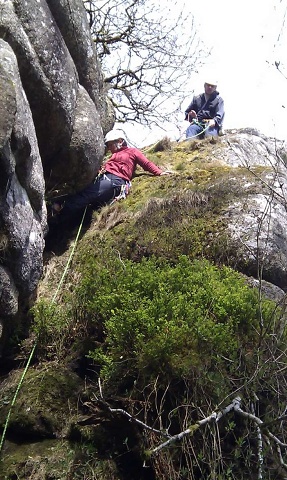 Sharon tackles the awkward top boulder