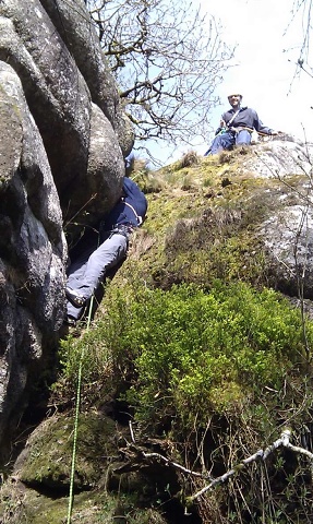 Jon at the awkward top boulder and Dave looking concerned for him