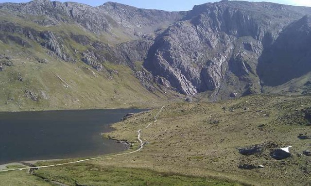 Approaching the western shore of Llyn Idwal. Idwal slabs in the sunshine on the far side.